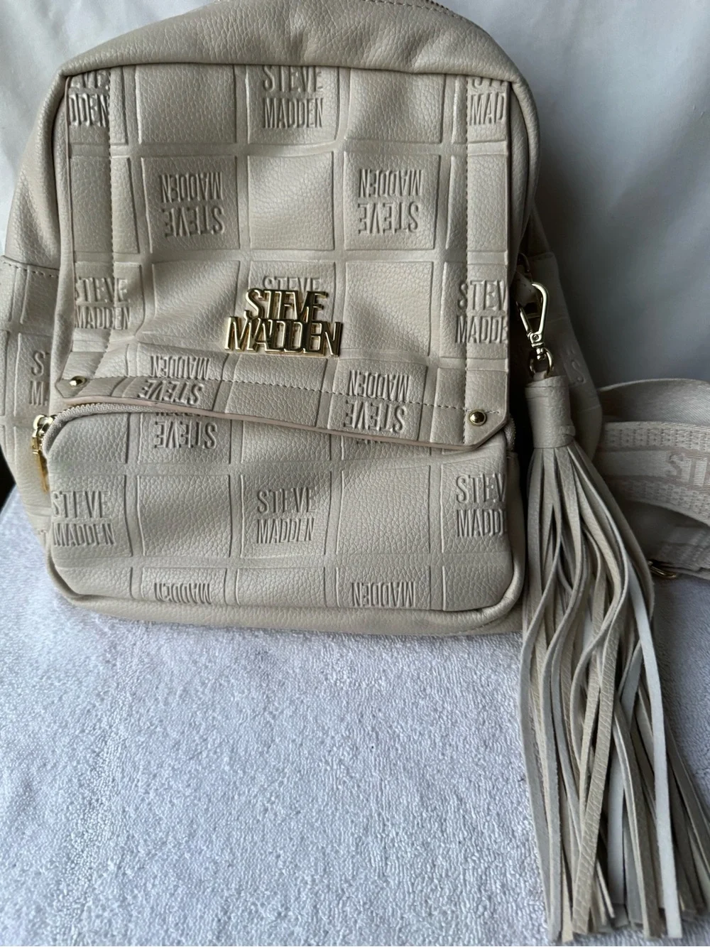 Steve Madden Cream Quilted Logo Backpack with Tassel